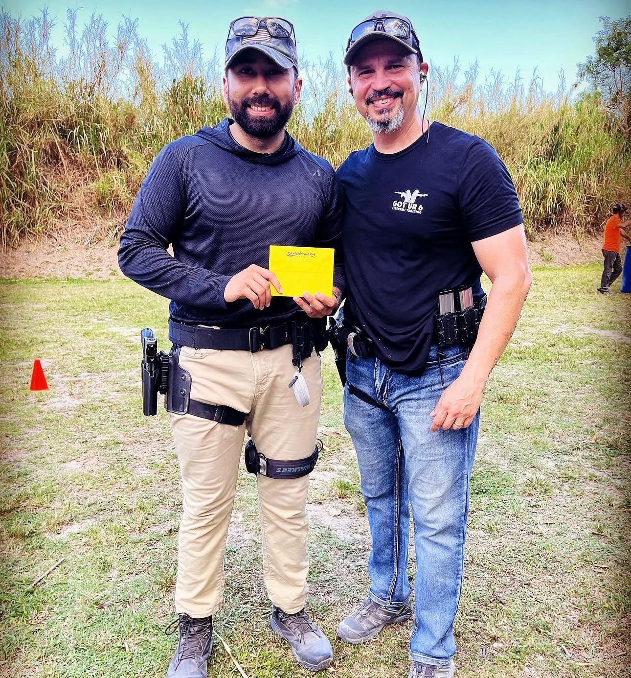 Sig with a student after training